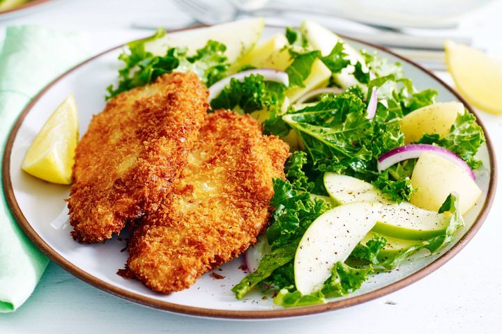 Cooking Meat Pork schnitzel with apple and kale salad