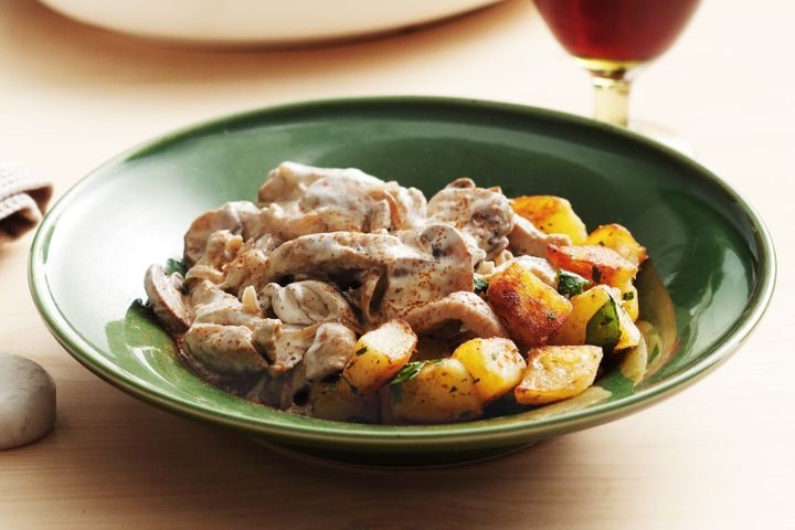 Cooking Meat Pork stroganoff with pan-fried potatoes
