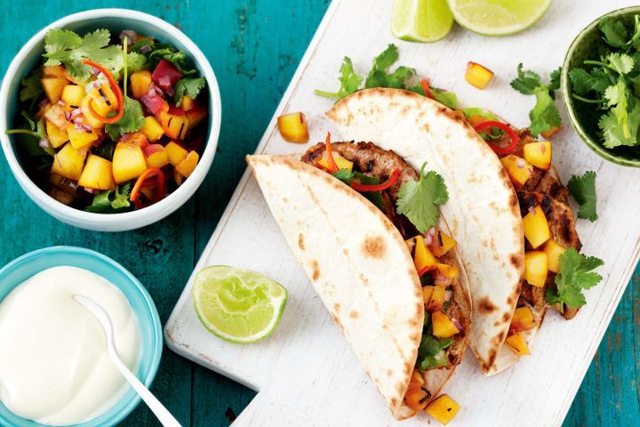 Cooking Meat Pork tacos with grilled peach salsa