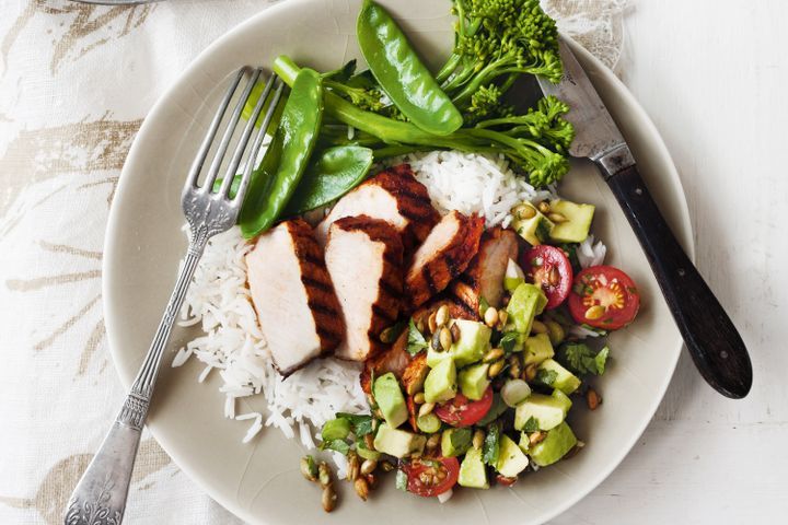 Cooking Meat Pork with avocado, cherry tomato and pepita salsa