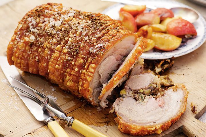 Cooking Meat Prune and couscous stuffed roast pork with baby apples