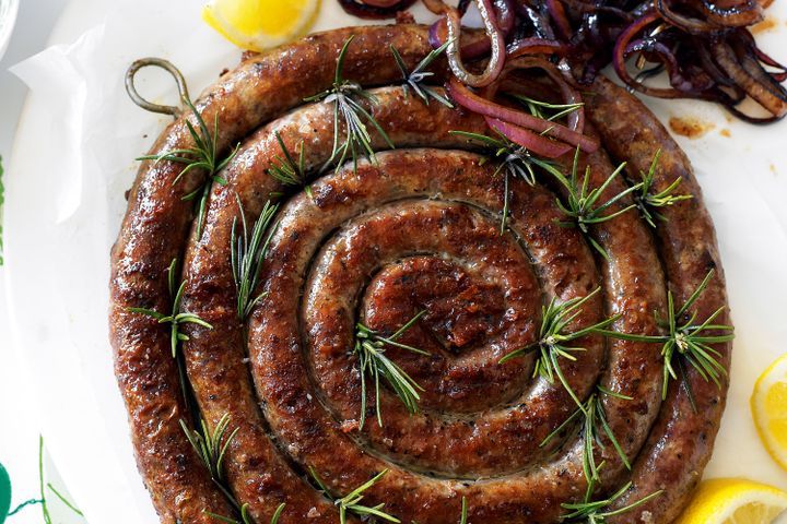Cooking Meat Sausage coil with feta cream & grilled onions
