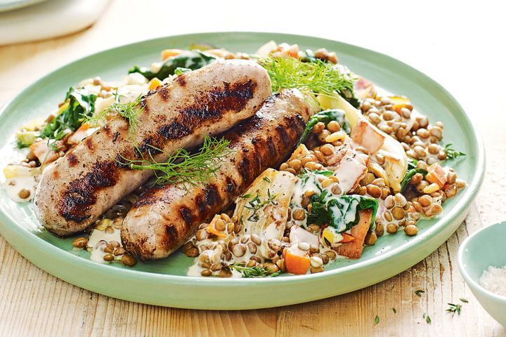 Cooking Meat Sausages with creamy lentils and bacon