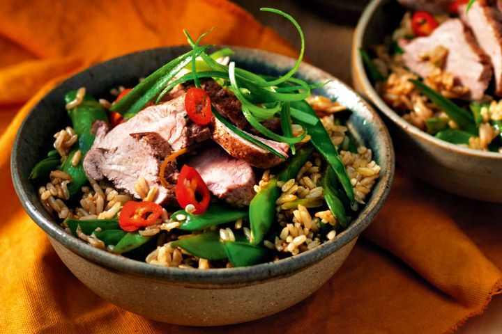 Cooking Meat Spiced pork with fried brown rice