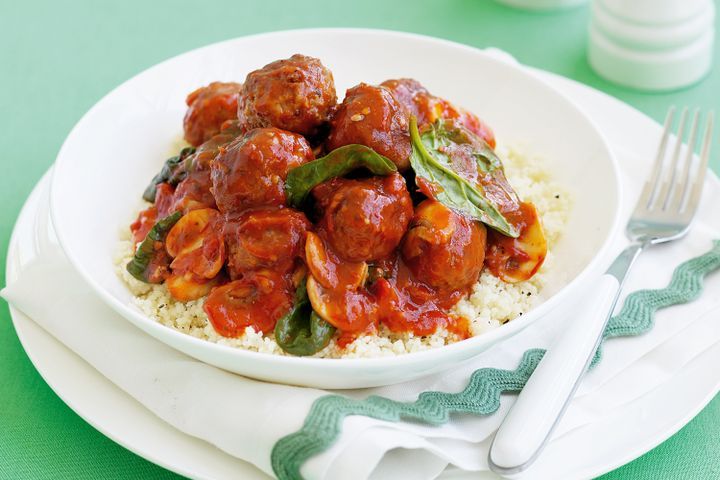 Cooking Meat Spicy meatballs with mushrooms, spinach and couscous