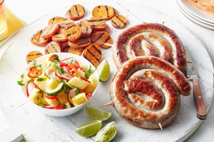 Cooking Meat Spiral pork sausages with pineapple salsa