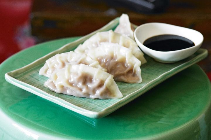 Cooking Meat Steamed jiaozi with soy & chilli sauce