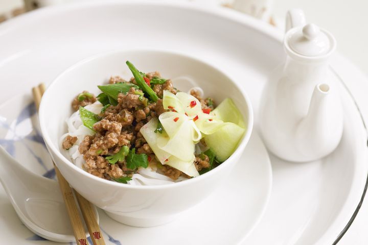 Cooking Meat Stir-fried pork and pickled cucumber on rice noodles