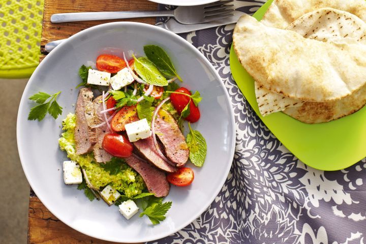 Cooking Salads Lamb with pea hummus and tomato herb salad