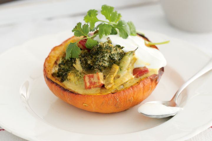 Cooking Vegetarian Baby pumpkins stuffed with coconut vegetables