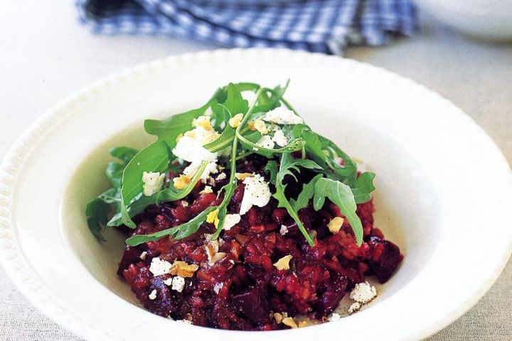 Cooking Vegetarian Beetroot risotto with goats cheese and walnuts (vegetarian)