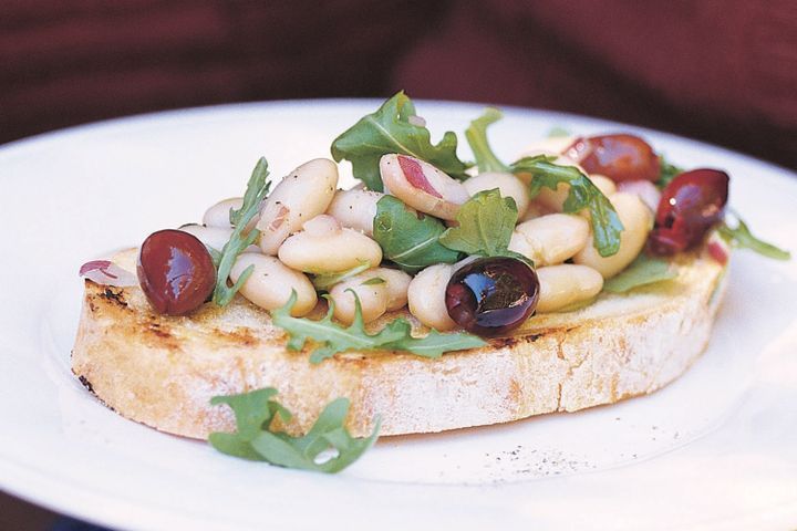 Cooking Vegetarian Bruschetta with white beans and olives
