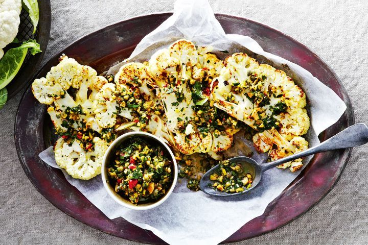 Cooking Vegetarian Cauliflower steaks with olive and herb salsa