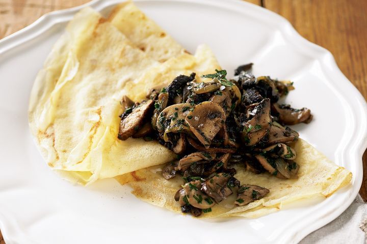 Cooking Vegetarian Crepes with mixed mushroom