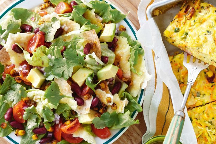 Cooking Vegetarian Crunchy corn and tortilla salad with tomato dressing