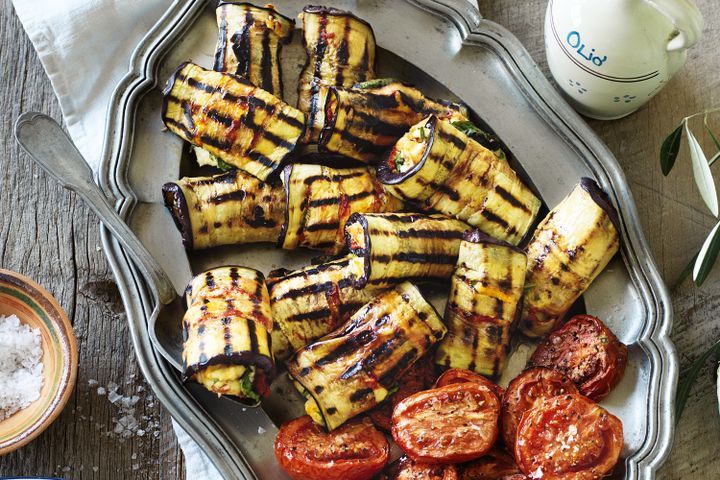 Cooking Vegetarian Eggplant involtini with roasted roma tomatoes