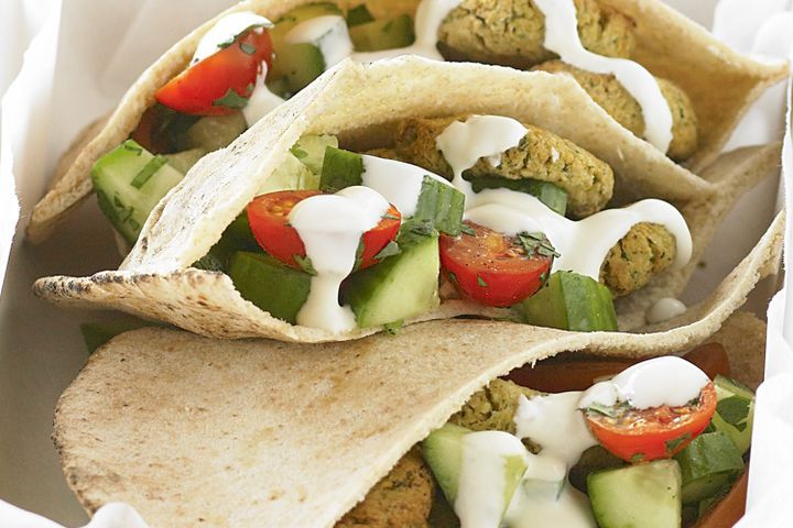 Cooking Vegetarian Falafel pockets with cucumber and tomato