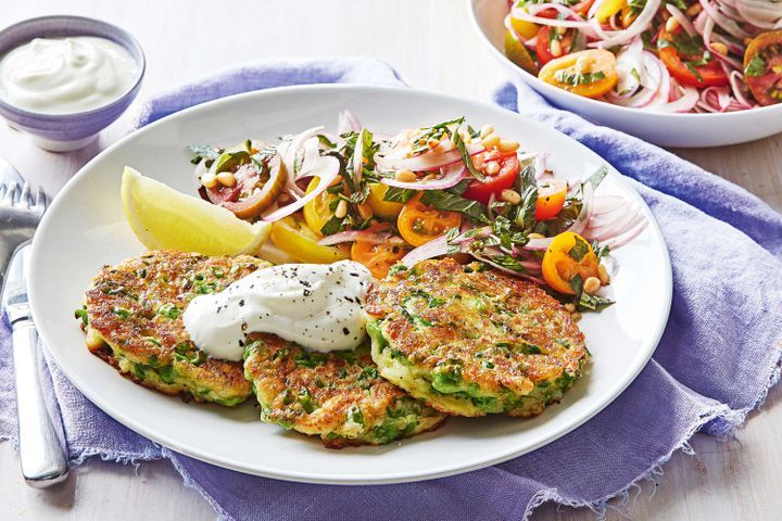 Cooking Vegetarian Haloumi and pea fritters with tomato salad