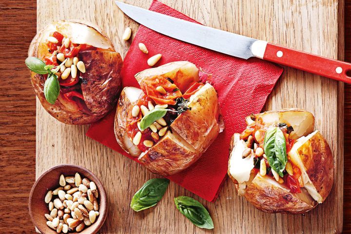 Cooking Vegetarian Jacket potatoes with basil and tomato sauce