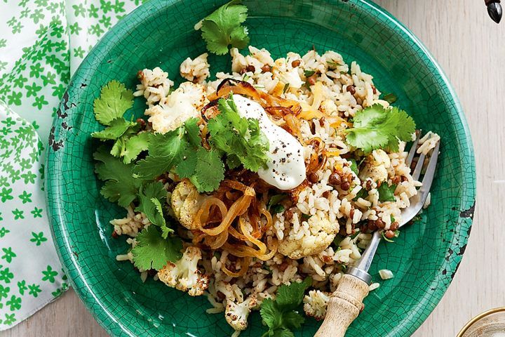 Cooking Vegetarian Lebanese rice with lentils and toasted cauliflower