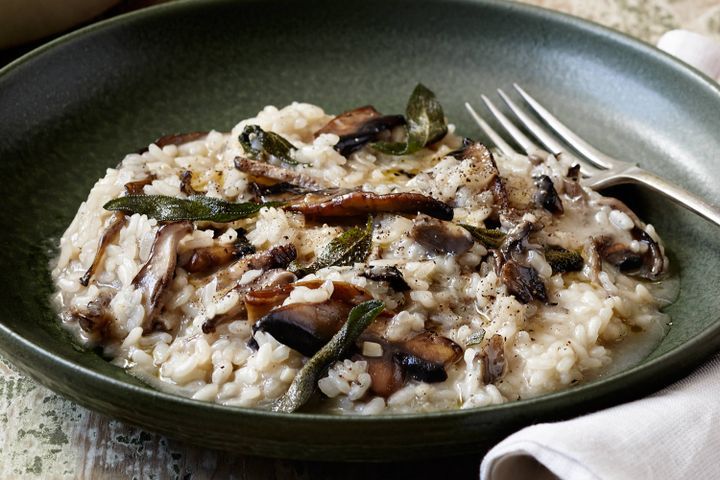 Cooking Vegetarian Mushroom risotto with black pepper and sage