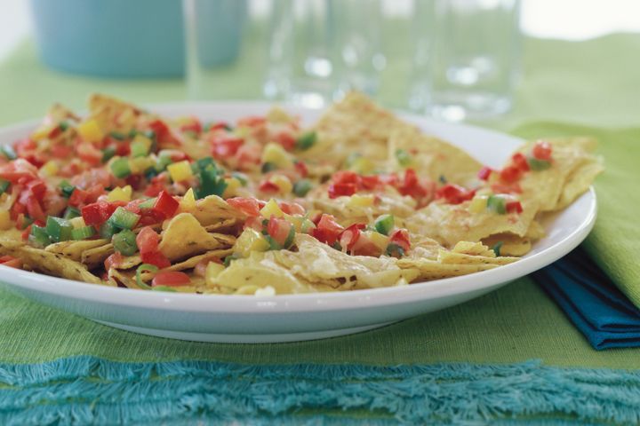 Cooking Vegetarian Nachos with fresh salsa