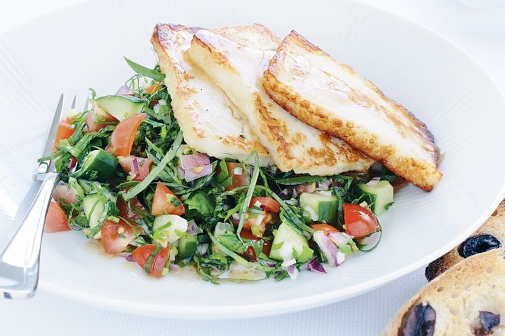 Cooking Vegetarian Pan-fried haloumi with tomato and basil salad and toasted olive bread