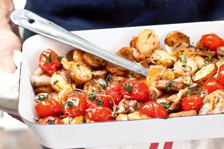 Cooking Vegetarian Pan-fried herby potatoes with sweet oven-roasted onions and cherry tomatoes