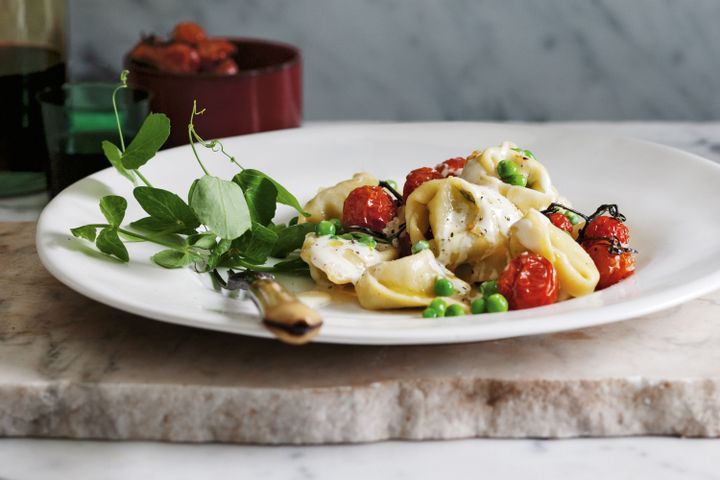 Cooking Vegetarian Pea tortellini with parmesan cream and slow-roasted tomatoes