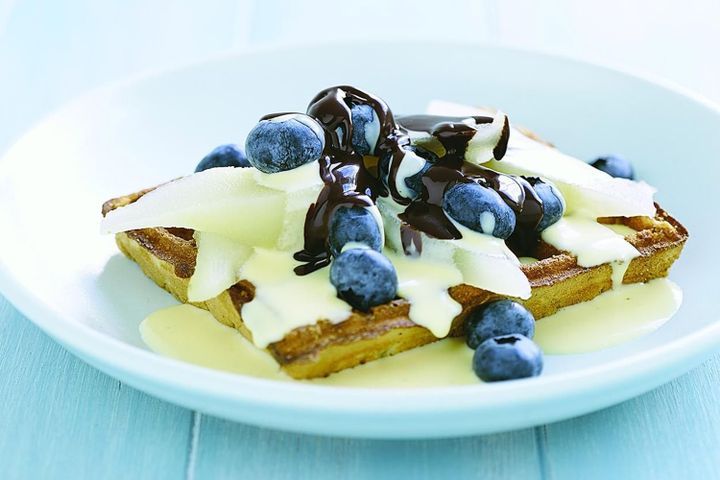Cooking Vegetarian Pear & blueberry waffles with chocolate sauce and custard
