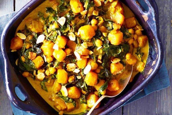 Cooking Vegetarian Pumpkin curry with chickpeas, silverbeet and almonds