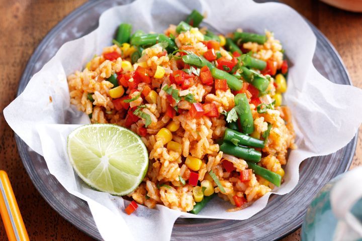 Cooking Vegetarian Red rice with vegetables