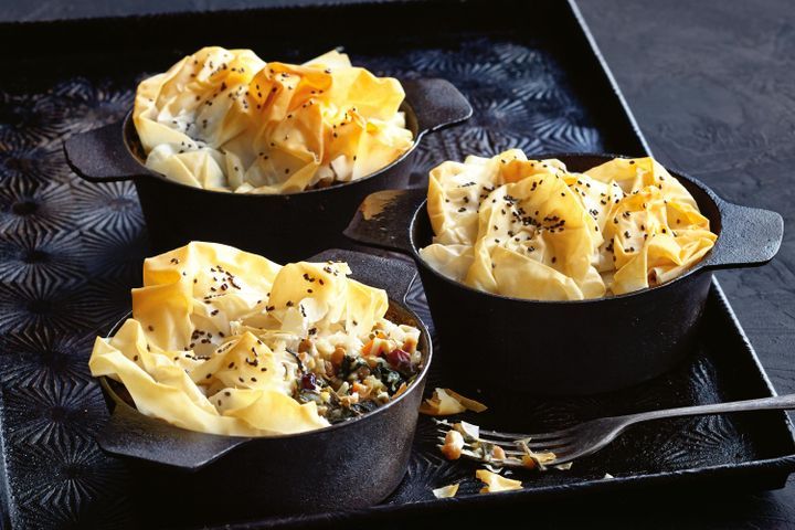 Cooking Vegetarian Silverbeet pies with filo chia topping