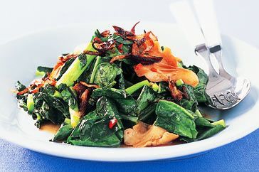 Cooking Vegetarian Stir-fried Chinese broccoli with crispy eschallots