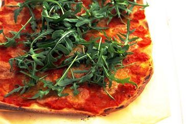 Cooking Vegetarian Tomato, bocconcini and rocket pizzas