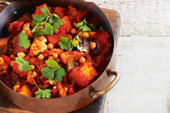 Cooking Vegetarian Vegetable tagine with crispy chickpeas