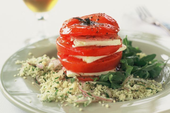 Cooking Vegetarian Warm stuffed tomato on couscous