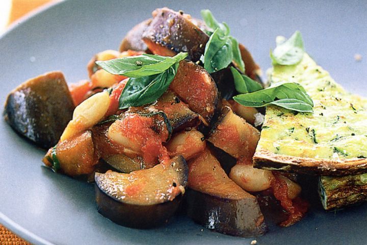 Cooking Vegetarian Zucchini frittata with bean ratatouille