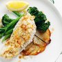 Almond and coconut crusted fish on potato galettes with vanilla butter