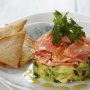 Avocado and salmon stack with melba toast