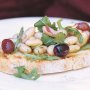 Bruschetta with white beans and olives