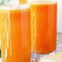 Chamomile, carrot and orange drink with hummus crispbread