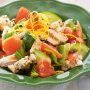 Chicken salad with tomato, capers and garlic croutons