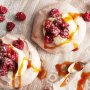 Chocolate meringues with raspberries and caramel sauce