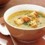 Creamy sweet potato, onion and pumpkin soup with croutons