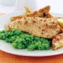 Crisp fish with green pea mash and potato wedges