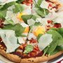 Egg, tomato and spinach pizzas