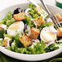 Egg and lettuce salad with garlic and herb croutons