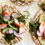 Mini pizzas with smoked salmon & herbed hummus