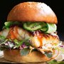 Miso fish burger with pickled cucumber and slaw
